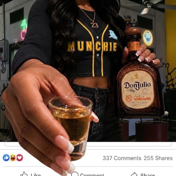 A person in a "MUNCHIE" shirt holds a Don Julio tequila bottle and a shot glass.