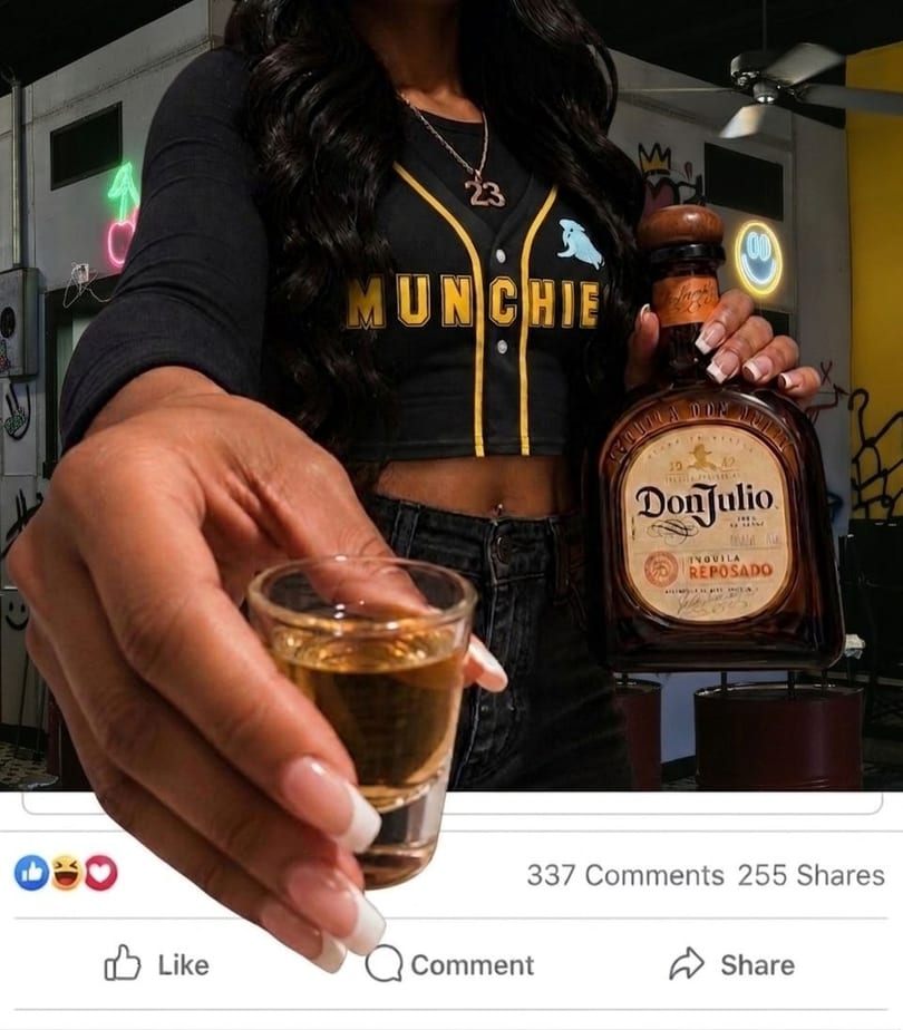 A person in a "MUNCHIE" shirt holds a Don Julio tequila bottle and a shot glass.